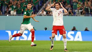 Soccer Football - FIFA World Cup Qatar 2022 - Group C - Mexico v Poland - Stadium 974, Doha, Qatar - November 22, 2022 
Poland's Robert Lewandowski reacts after having a penalty kick saved by Mexico's Guillermo Ochoa REUTERS/Hannah Mckay