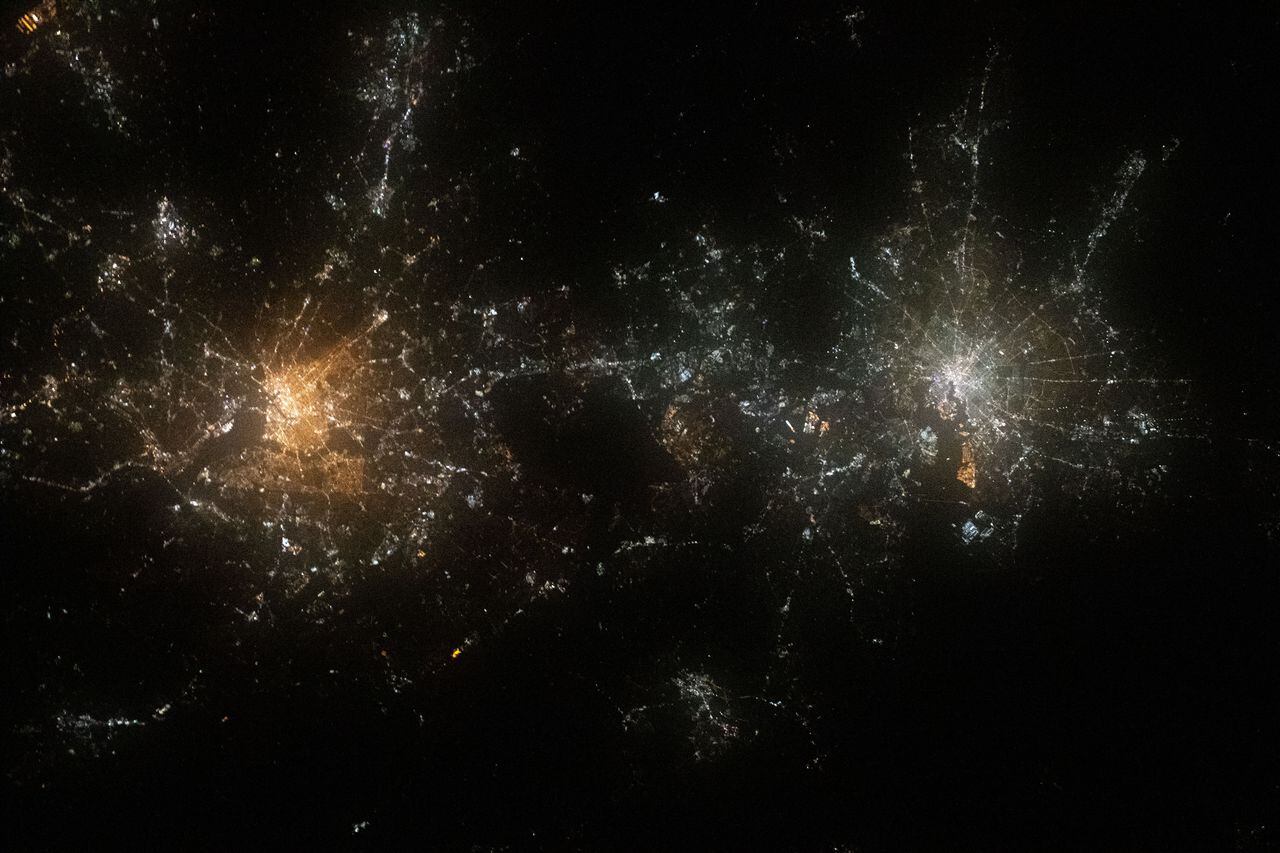 Sept. 15, 2020) --- Like two galaxies nearing each other, this nighttime shot from the International Space Station shows the well-lit cities of Washington, D.C. (left), Baltimore, Maryland (right) and their surrounding suburbs.