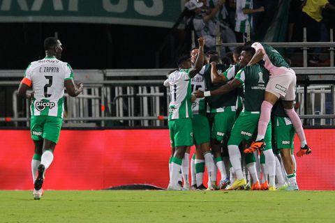 Players of Atletico Nacional celebrate after scoring during the Copa Libertadores round of 16 first leg football match between Colombia's Atletico Nacional and Argentina's Racing Club at the Atanasio Girardot stadium in Medellin, Colombia, on August 3, 2023. (Photo by Fredy BUILES / AFP)