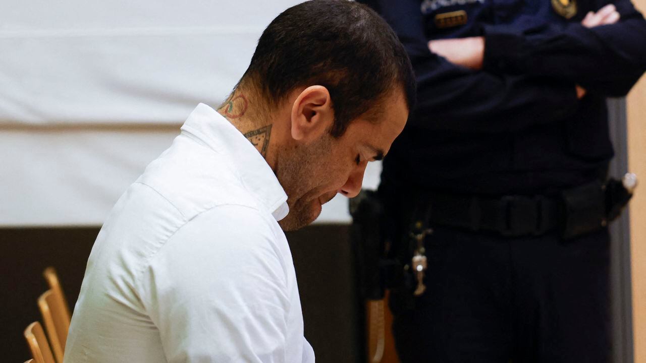Brazilian footballer Dani Alves reacts at the start of his trial at the High Court of Justice of Catalonia in Barcelona, on February 5, 2024. Brazilian footballer Dani Alves, a former star at Barca and PSG, goes on trial in Barcelona accused of raping a woman in a local nightclub. Prosecutors are asking for a nine-year prison sentence, followed by 10 years of conditional liberty. They are also asking he pay 150,000 euros ($162,000) in compensation to the woman. (Photo by Alberto Estevez and ALBERTO EST�VEZ / POOL / AFP)