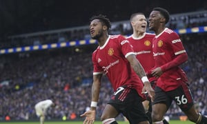 Manchester United's Fred, left, celebrates after scoring his side's third goal during the English Premier League soccer match between Leeds United and Manchester United, at Elland Road Stadium in Leeds, England, Sunday, Feb. 20, 2022. (AP/Jon Super)