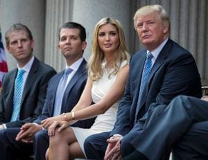 FILE - Donald Trump, right, sits with his children, from left, Eric Trump, Donald Trump Jr., and Ivanka Trump during a groundbreaking ceremony for the Trump International Hotel on July 23, 2014, in Washington. A New York appeals court dismissed Ivanka Trump on Tuesday, June 27, 2023, from a wide-ranging fraud lawsuit brought against her father and his company last year by the state's attorney general. (AP Photo/Evan Vucci, File)