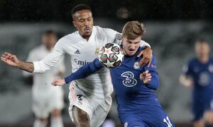 Chelsea's Timo Werner vies for the ball with Real Madrid's Eder Militao, left, during the Champions League semifinal first leg soccer match between Real Madrid and Chelsea at the Alfredo di Stefano stadium in Madrid, Spain, Tuesday, April 27, 2021. (AP Photo/Bernat Armangue)