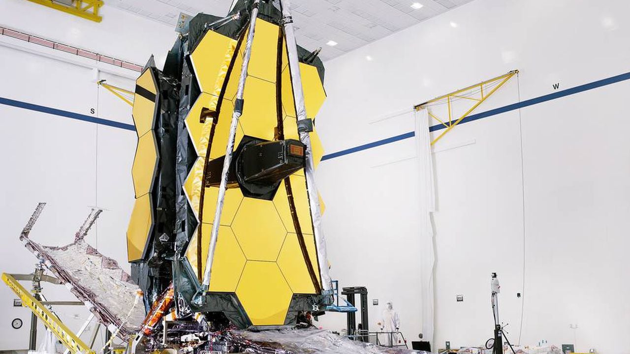 The fully assembled James Webb Space Telescope with its sunshield and unitized pallet structures (UPSs) that fold up around the telescope for launch, are seen partially deployed to an open configuration to enable telescope installation.
Credits: NASA/Chris Gunn