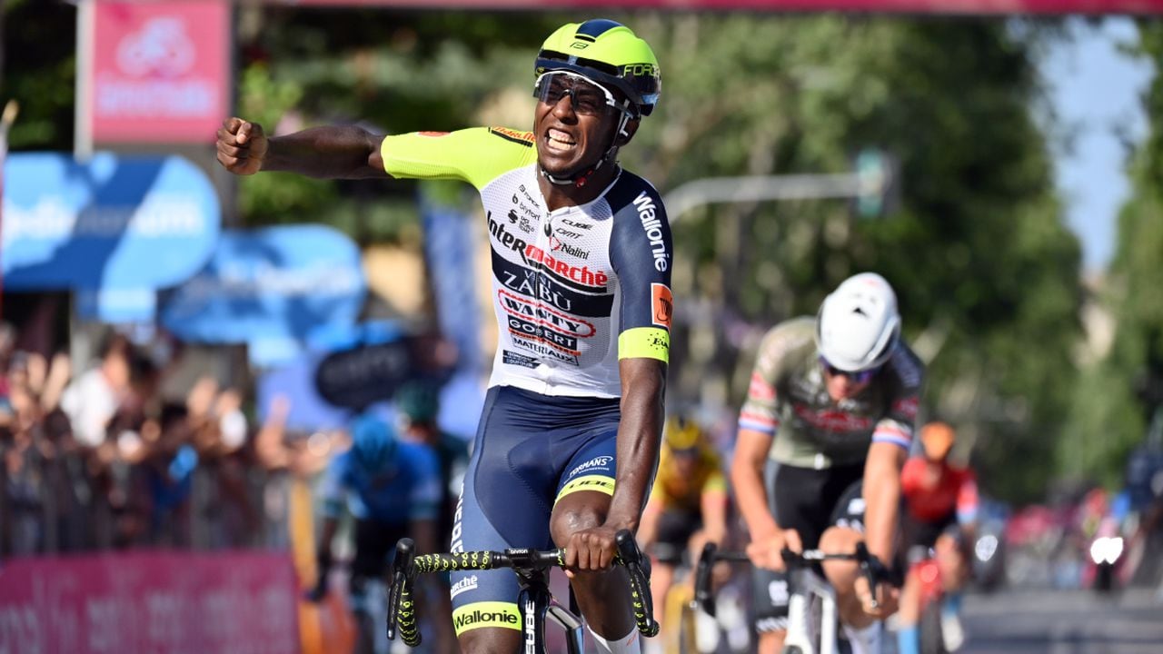 Eritrea's Biniam Girmay celebrates as he crosses the finish line of the 10th stage of the Giro D'Italia cycling race from Pescara to Jesi, Italy, Tuesday, May 17, 2022. (Massimo Paolone/LaPresse vida AP)