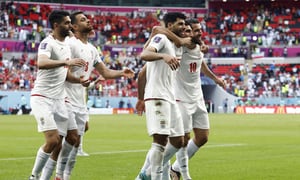 Soccer Football - FIFA World Cup Qatar 2022 - Group B - Wales v Iran - Ahmad Bin Ali Stadium, Al Rayyan, Qatar - November 25, 2022 Iran players celebrate after the match REUTERS/Amanda Perobelli