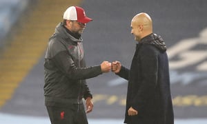Liverpool manager Jurgen Klopp (left) and Manchester City manager Pep Guardiola after the final whistle during the Premier League match at the Etihad Stadium, Manchester. (Photo by Martin Rickett/PA Images via Getty Images)