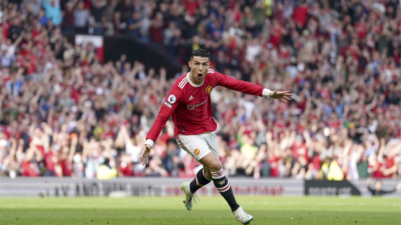 Manchester United's Cristiano Ronaldo celebrates after scoring his third goal during the English Premier League soccer match between Manchester United and Norwich City at Old Trafford stadium in Manchester, England, Saturday, April 16, 2022. (AP/Jon Super)