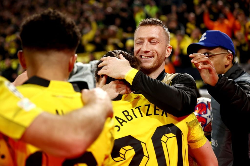 DORTMUND, GERMANY - APRIL 16: Marcel Sabitzer of Borussia Dortmund celebrates scoring his team's fourth goal with teammate Marco Reus during the UEFA Champions League quarter-final second leg match between Borussia Dortmund and Atletico Madrid at Signal Iduna Park on April 16, 2024 in Dortmund, Germany. (Photo by Leon Kuegeler/Getty Images)