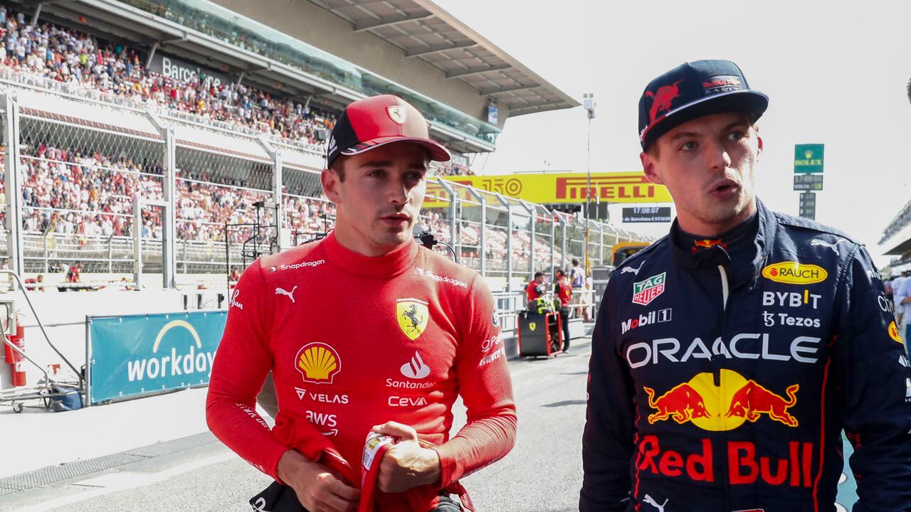 Ferrari driver Charles Leclerc of Monaco, left, pole position, is flanked by second fastest time Red Bull driver Max Verstappen of the Netherlands after the qualifying session at the Barcelona Catalunya racetrack in Montmelo, Spain, Saturday, May 21, 2022. The Formula One race will be held on Sunday. (AP Photo/Joan Monfort)