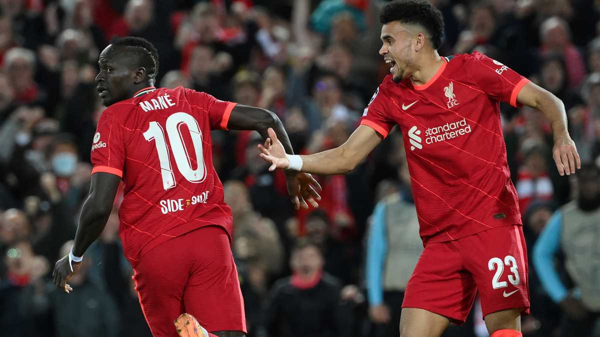 Liverpool's Senegalese striker Sadio Mane (L) celebrates with Liverpool's Colombian midfielder Luis Diaz after scoring his team second goal during the UEFA Champions League semi-final first leg football match between Liverpool and Villarreal, at the Anfield Stadium, in Liverpool, on April 27, 2022.
AFP/LLUIS GENE