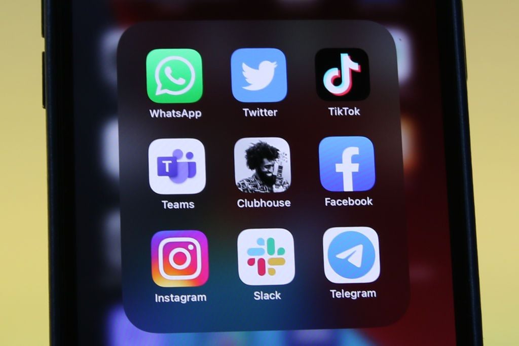 25 January 2021, Berlin: The logos of social media platforms WhatsApp (l-r), Twitter, TikTok, Microsoft Teams, Clubhouse, Facebook, Instagram, Slack and Telegram are seen on an iPhone 12 Pro Max. Photo: Christoph Dernbach/dpa (Photo by Christoph Dernbach/picture alliance via Getty Images)