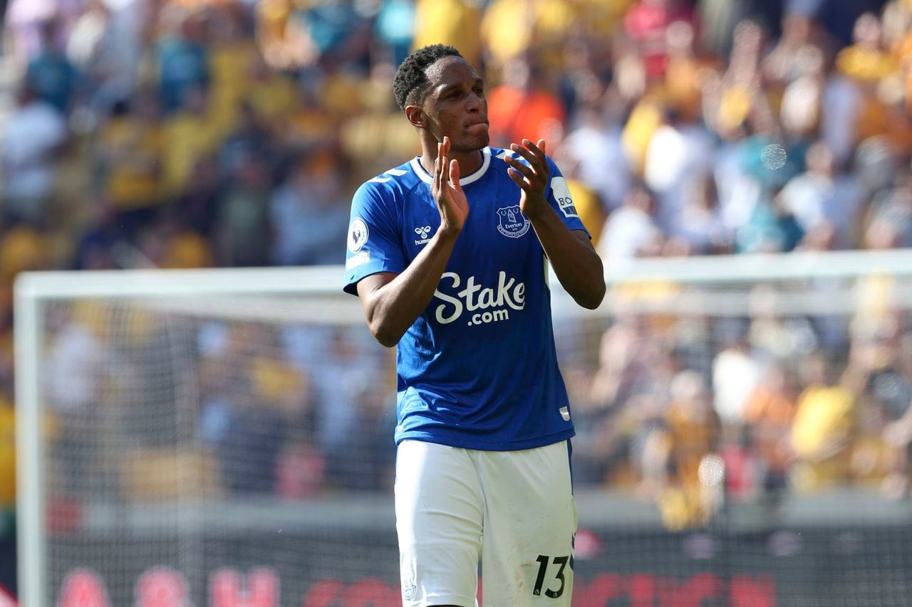 Everton's Yerry Mina applauds the fans after the English Premier League soccer match between Wolverhampton Wanderers and Everton at the Molineux Stadium, Wolverhampton, Saturday May 20, 2023. (Barrington Coombs/PA via AP)