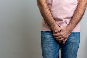 Sick man prostate cancer, prostate inflammation, premature ejaculation, fertility, erection or bladder problem. Man with hands holding his crotch, he wants to pee - urinary incontinence concept