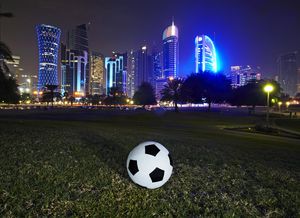 Football and skyline of the West Bay Doha. Qatar is set to stage the 2022 world cup football tournament, the first Middle east country to do so.