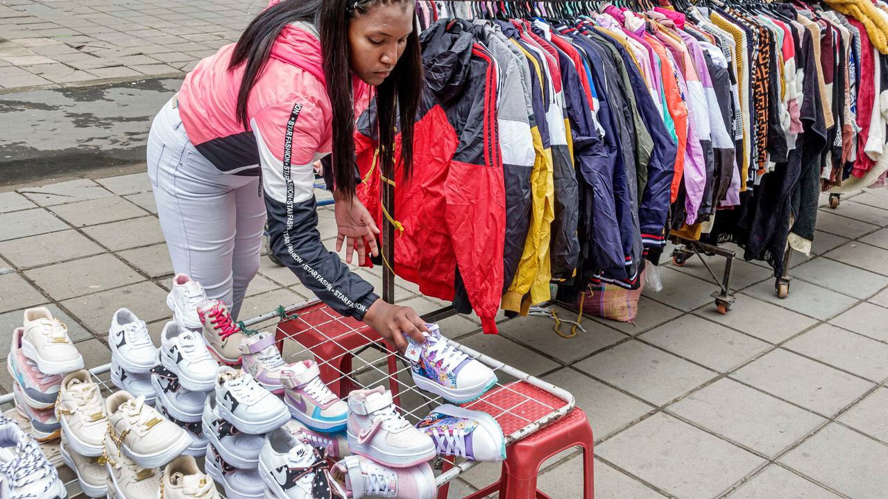 Bogota, Colombia, Plaza la Mariposa de San Victorino market, vendor selling activewear, jackets and athletic shoes. (Photo by: Jeffrey Greenberg/Universal Images Group via Getty Images)