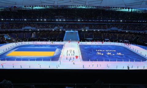 Team Ukraine make their entrance during the opening ceremony at the 2022 Winter Paralympics, Friday, March 4, 2022, in Beijing. (AP/Dita Alangkara)