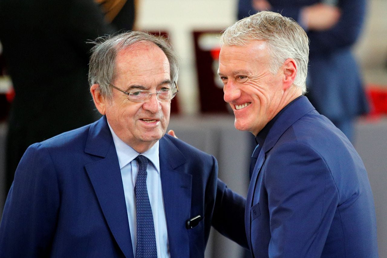 (FILES) In this file photo taken on June 4, 2019 French football Federation president Noel Le Graet (L) and French national football team head coach Didier Deschamps share a laugh during a Legion of Honour award ceremony for French 2018 football World Cup winners at the Elysee Palace in Paris. - Didier Deschamps extends stay as France coach until 2026, he announced at the French Football Federation's general assembly in Paris on January 7, 2023. (Photo by Francois Mori / POOL / AFP)