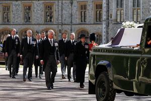 From front left, Britain's Prince Charles, Princess Anne, Prince Andrew. Prince Edward, Prince William, Peter Phillips, Prince Harry, Earl of Snowdon and Tim Laurence follow the coffin in a ceremonial procession for the funeral of Britain's Prince Philip inside Windsor Castle in Windsor, England Saturday April 17, 2021. Prince Philip died April 9 at the age of 99 after 73 years of marriage to Britain's Queen Elizabeth II. (Alastair Grant/Pool via AP)