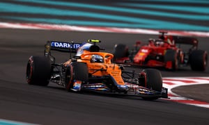 ABU DHABI, UNITED ARAB EMIRATES - DECEMBER 12: Lando Norris of Great Britain driving the (4) McLaren F1 Team MCL35M Mercedes leads Charles Leclerc of Monaco driving the (16) Scuderia Ferrari SF21 during the F1 Grand Prix of Abu Dhabi at Yas Marina Circuit on December 12, 2021 in Abu Dhabi, United Arab Emirates. (Photo by Clive Rose/Getty Images)