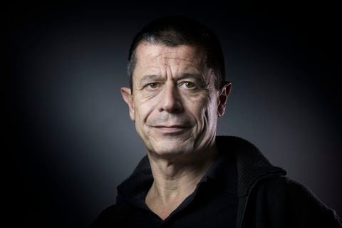 (FILES) In this file photo taken on February 17, 2016 French writer Emmanuel Carrere poses for a photograph in Paris. - Emmanuel Carrere has been awarded on June 9, 2021 the Princess of Asturias Award for Literature, the jury announced. (Photo by JOEL SAGET / AFP)