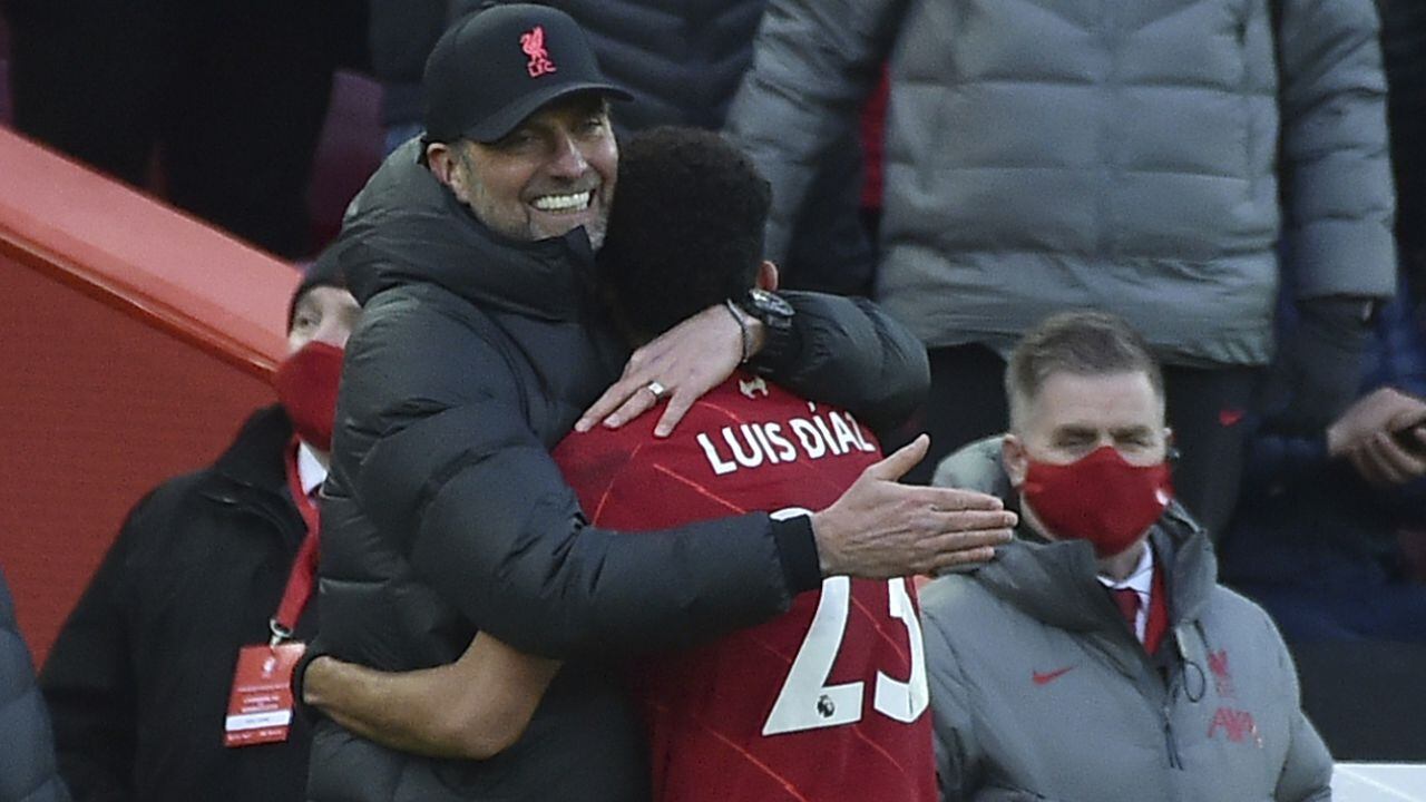 Liverpool's manager Jurgen Klopp, left hugs Liverpool's Luis Diaz as he is substituted during the English Premier League soccer match between Liverpool and Norwich City and at Anfield stadium in Liverpool, England, Saturday, Feb. 19, 2022. (AP/Rui Vieira)