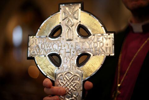 Archbishop of Wales Andrew John poses with the new Cross of Wales, which will be used in the procession during the Coronation of Britain’s King Charles, before a service at Holy Trinity Church in Llandudno, Britain April 19, 2023. REUTERS/Phil Noble