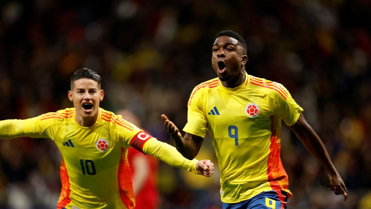 Colombia's forward #09 Jhon Cordoba (R) celebrates scoring his team's first goal during the international friendly football match between Romania and Colombia at the Metropolitano stadium in Madrid on March 26, 2024. (Photo by OSCAR DEL POZO / AFP)