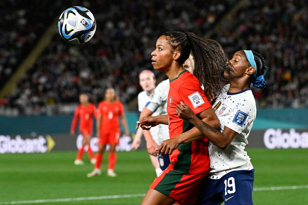 Portugal's Jessica Silva, left, and United States' Crystal Dunn battle for the ball during the Women's World Cup Group E soccer match between Portugal and the United States at Eden Park in Auckland, New Zealand, Tuesday, Aug. 1, 2023. (AP Photo/Andrew Cornaga)