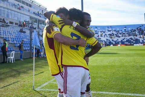 Colombia's Tomas Angel, left, is congratulated after scoring his side's 4th goal against Slovakia during a FIFA U-20 World Cup round of 16 soccer match at the Bicentenario stadium in San Juan, Argentina, Wednesday, May 31, 2023. (AP Photo/Ricardo Mazalan)