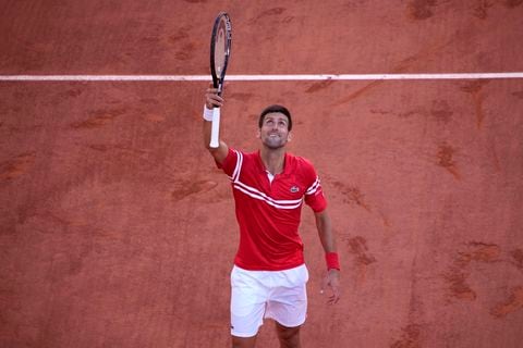 Serbia's Novak Djokovic reacts after defeating Stefanos Tsitsipas of Greece during their final match of the French Open tennis tournament at the Roland Garros stadium Sunday, June 13, 2021 in Paris. Djokovic 6-7, 2-6, 6-3, 6-2, 6-4.(AP Photo/Christophe Ena)