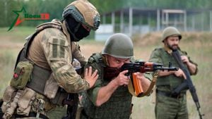 A fighter from Russian Wagner mercenary group conducts training for Belarusian soldiers on a range near the town of Osipovichi, Belarus July 14, 2023 in this still image taken from handout video.  Voen Tv/Belarusian Defence Ministry/Handout via REUTERS  ATTENTION EDITORS - THIS IMAGE WAS PROVIDED BY A THIRD PARTY. NO RESALES. NO ARCHIVES. MANDATORY CREDIT
