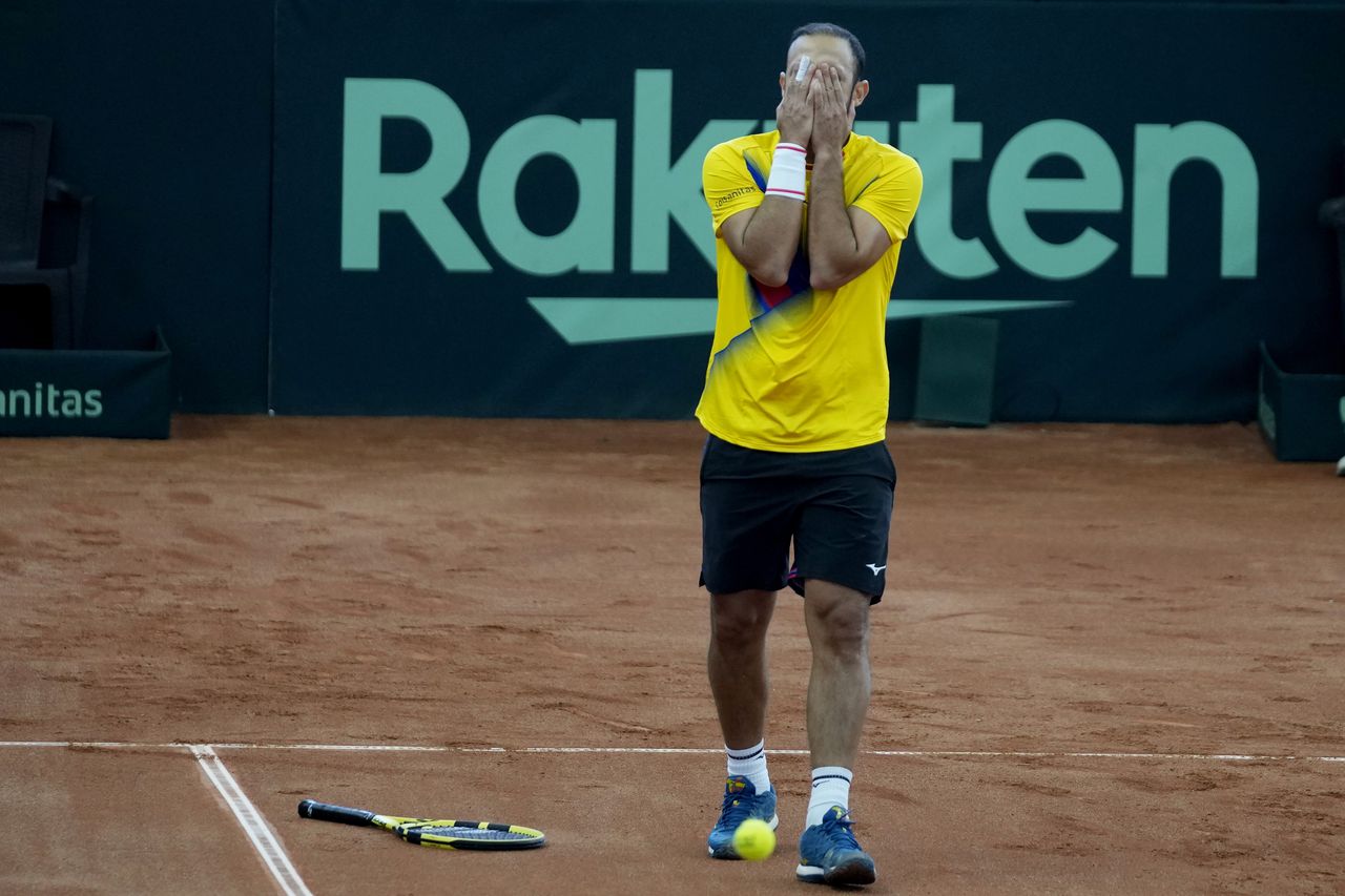 Colombia's Juan Cabal reacts after losing a point during a Davis Cup qualification doubles match against Neal Skupski and Dan Evans, of Britain, in Cota, Colombia, Saturday, Feb. 4, 2023. (AP Photo/Fernando Vergara)
