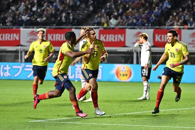 OSAKA, JAPAN - MARCH 28: Rafael Santos Borre (C) of Colombia celebrates after scoring the team's second goal with teammates Jhon Arias and Daniel Munoz during the international friendly between Japan and Colombia at Yodoko Sakura Stadium on March 28, 2023 in Osaka, Japan. (Photo by Kenta Harada/Getty Images)