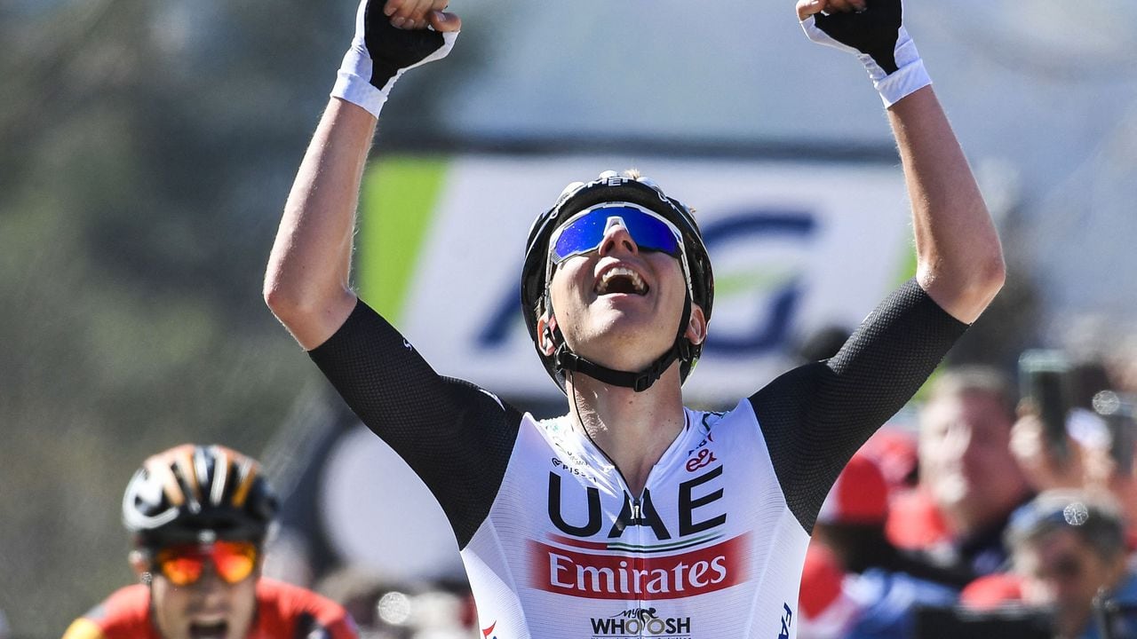 UAE Team Emirates' Slovenian rider Tadej Pogacar celebrates as he crosses the finish line during the 86th edition of the men's race 'La Fleche Wallonne', a one day cycling race (Waalse Pijl - Walloon Arrow), 194,2 km from Herve to Huy on April 19, 2023. (Photo by GOYVAERTS / Belga / AFP) / Belgium OUT
