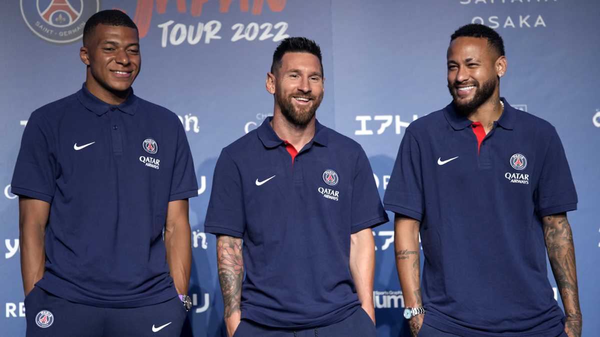 CORRECTS DATE - Paris Saint-Germain soccer players, Kylian Mbappe, left, Lionel Messi, center, and Neymar pose for photographers during a press conference in Tokyo Sunday, July 17, 2022. Paris Saint-Germain is in Japan for their pre-season tour.(AP/Shuji Kajiyama)