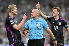 08 May 2024, Spain, Madrid: Soccer: Champions League, Real Madrid - Bayern Munich, knockout round, semi-final, second leg, Santiago Bernabeu. Referee Szymon Marciniak (M) confirms the offside goal by Matthijs de Ligt (l) of Munich. Photo: Peter Kneffel/dpa (Photo by Peter Kneffel/picture alliance via Getty Images)