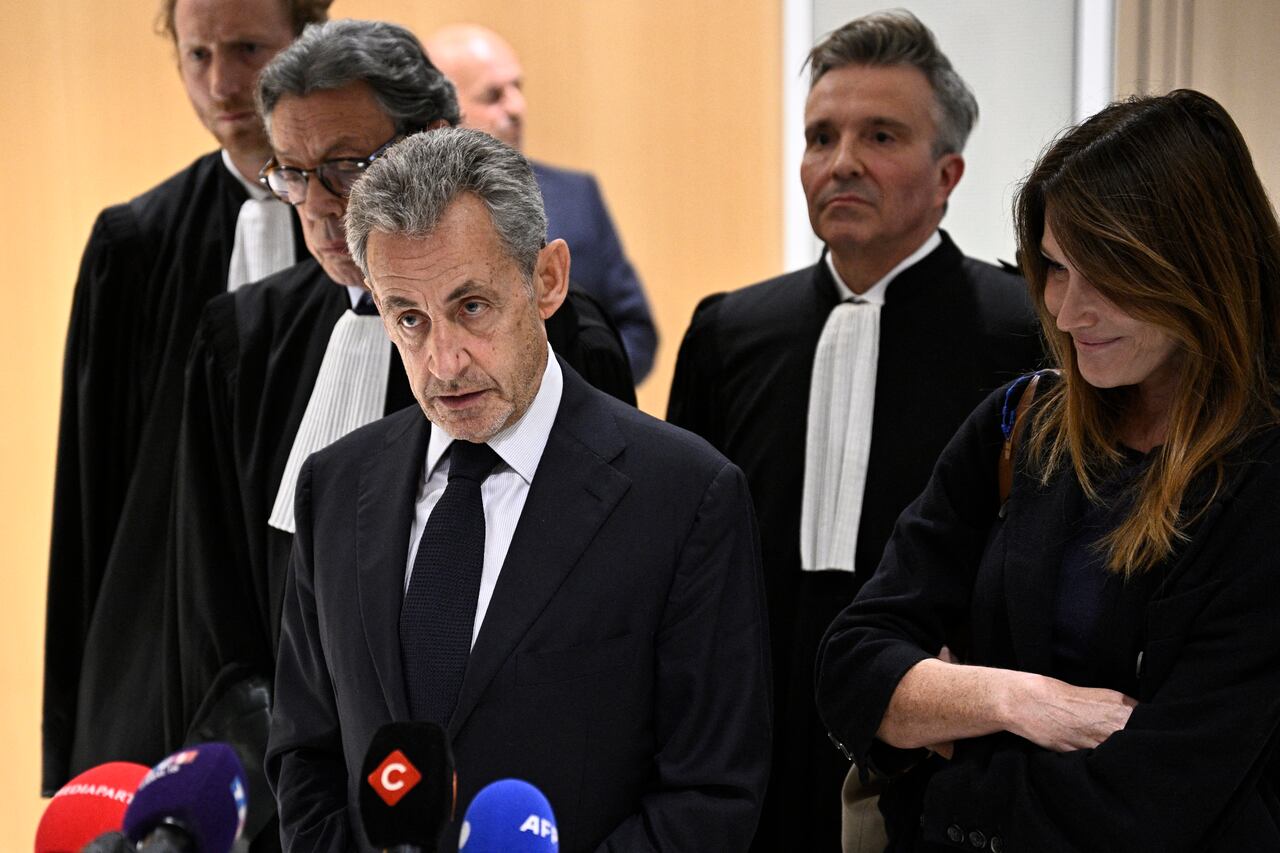 Former French president Nicolas Sarkozy leaves after the verdict in his trial for illegal campaign financing from Libya for his successful 2007 presidential bid, at the Tribunal de Paris courthouse in Paris, on September 25, 2025. A Paris court on September 25, 2025 sentenced former French president Nicolas Sarkozy to five years and ordered him to go to prison after finding him guilty of criminal conspiracy over accusations the late Libyan dictator Moamer Kadhafi helped fund his victorious 2007 presidential run. The court ordered that Sarkozy should be placed in custody at a later date, with prosecutors given one month to inform the former head of state when he should go to prison. (Photo by Alain JOCARD / AFP)