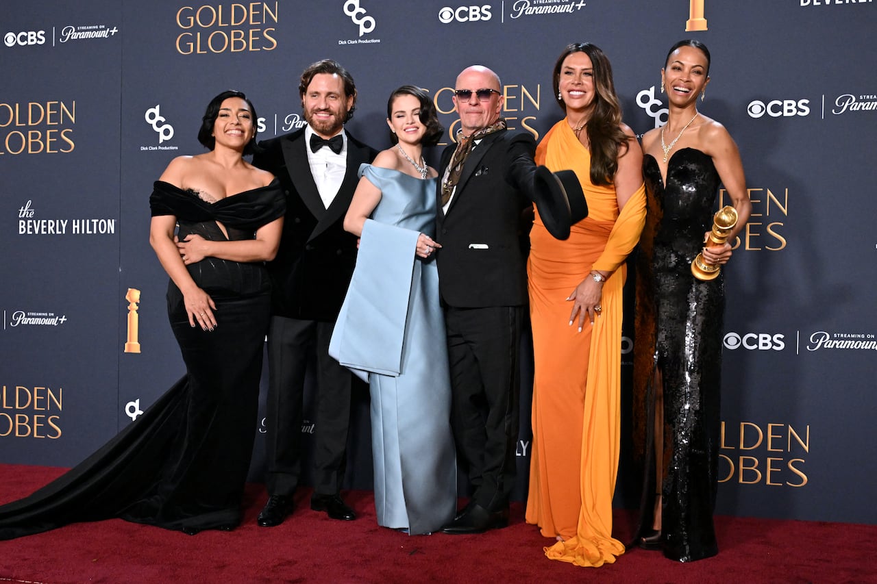 (From L) Mexican actress Adriana Paz, Venezuelan actor Edgar Ramirez, US singer and actress Selena Gomez, French director Jacques Audiard, Spanish actress Karla Sofia Gascon and US actress Zoe Saldana pose with the Best Motion Picture - Musical or Comedy award for "Emilia Perez" in the press room during the 82nd annual Golden Globe Awards at the Beverly Hilton hotel in Beverly Hills, California, on January 5, 2025. (Photo by Robyn BECK / AFP)