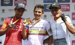 Colombian cyclists (L to R) Daniel Felipe Martinez, Esteban Chavez, and Nairo Quintana celebrate at the podium of the Ruta de Colombia championship in Bucaramanga, Colombia on February 5, 2023.
AFP/Jaime MORENO VARGAS