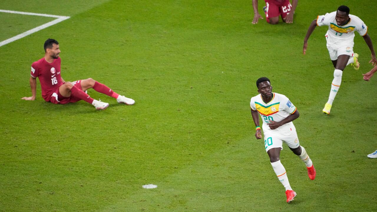 Senegal's Bamba Dieng celebrates after scoring during the World Cup group A soccer match between Qatar and Senegal, at the Al Thumama Stadium in Doha, Qatar, Friday, Nov. 25, 2022. (AP Photo/Ariel Schalit)