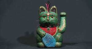 Si el gato levanta la mano izquierda, atrae riqueza y prosperidad.