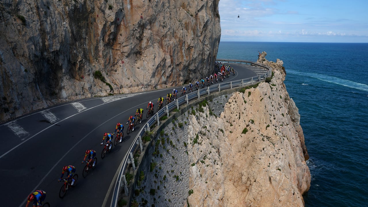 The pack rides at Noli's cape during the 4th stage of the 107th Giro d'Italia cycling race, 190 km between Acqui Terme and Andora, on May 7, 2024 in Noli. (Photo by Luca Bettini / AFP)