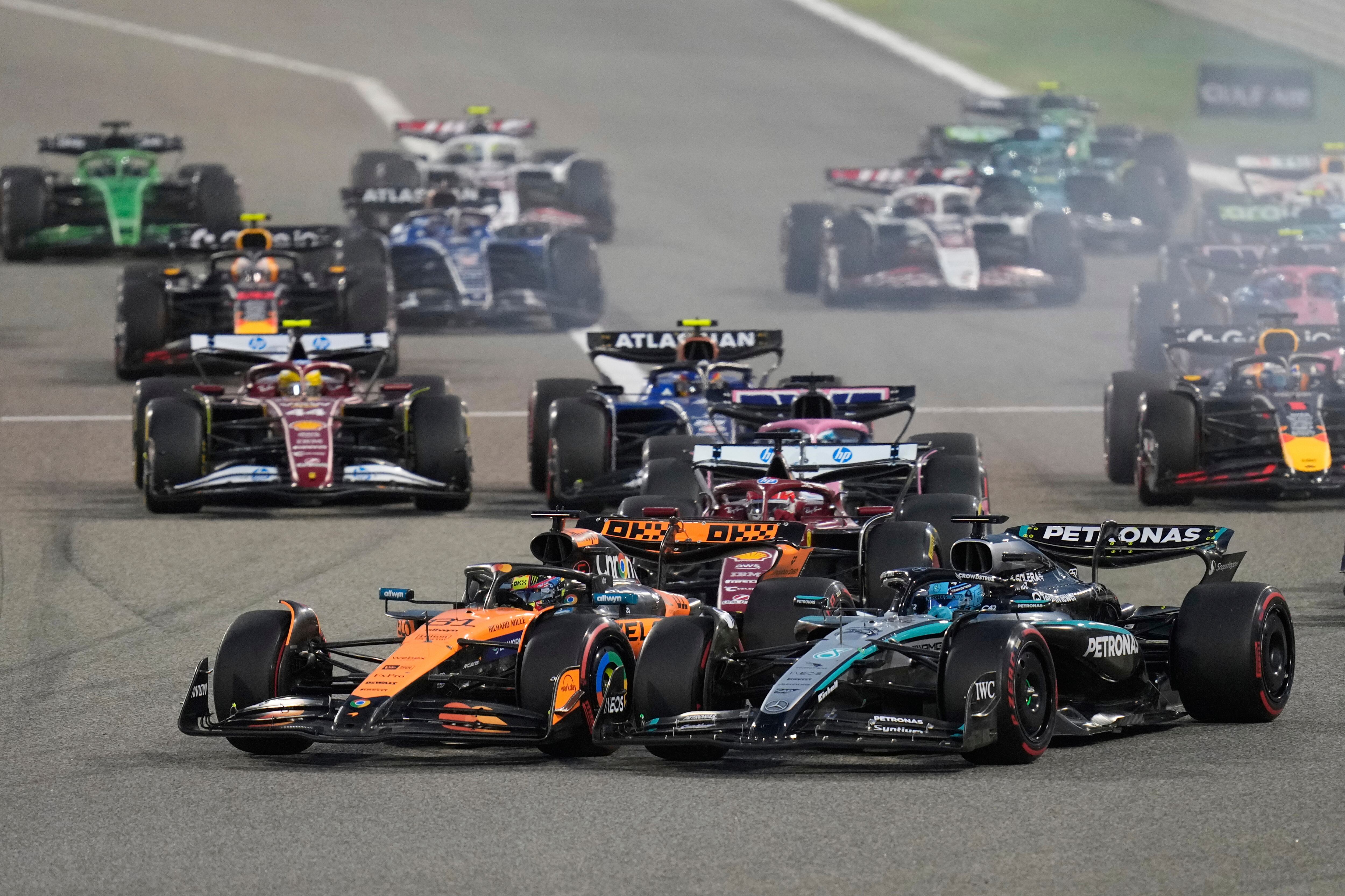 McLaren driver Oscar Piastri of Australia leadsin front of Mercedes driver George Russell of Britain at the start of the the Formula One Bahrain Grand Prix, in Sakhir, Sunday, April 13, 2025. (AP Photo/Darko Bandic)