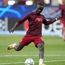 Liverpool's Sadio Mane takes a shot during warmup before the Champions League final soccer match between Liverpool and Real Madrid at the Stade de France in Saint Denis near Paris, Saturday, May 28, 2022. (AP/Manu Fernandez)