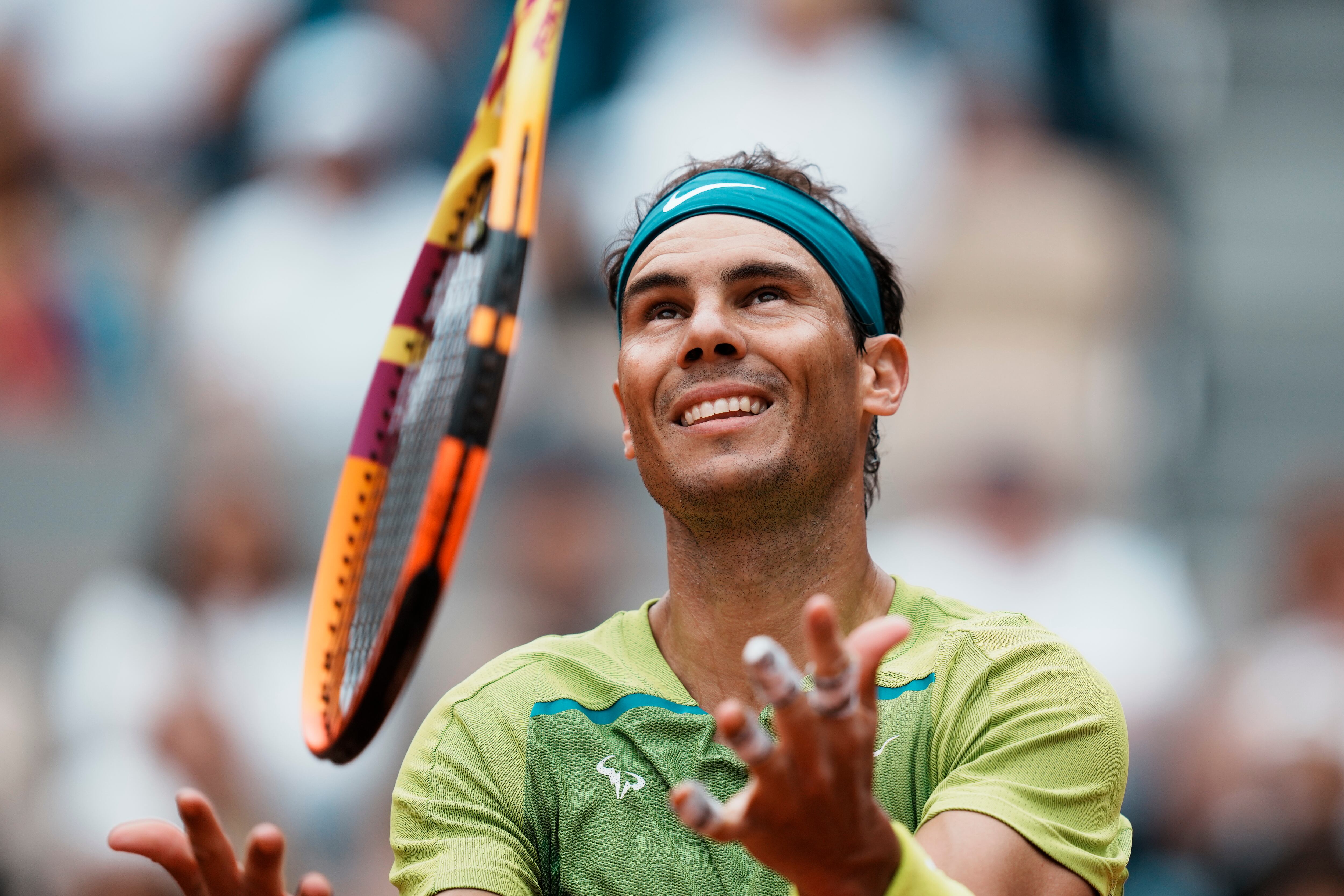 Spain's Rafael Nadal juggles with his racket during his first round match against Australia's Jordan Thompson at the French Open tennis tournament in Roland Garros stadium in Paris, France, Monday, May 23, 2022. (AP Photo/Thibault Camus)