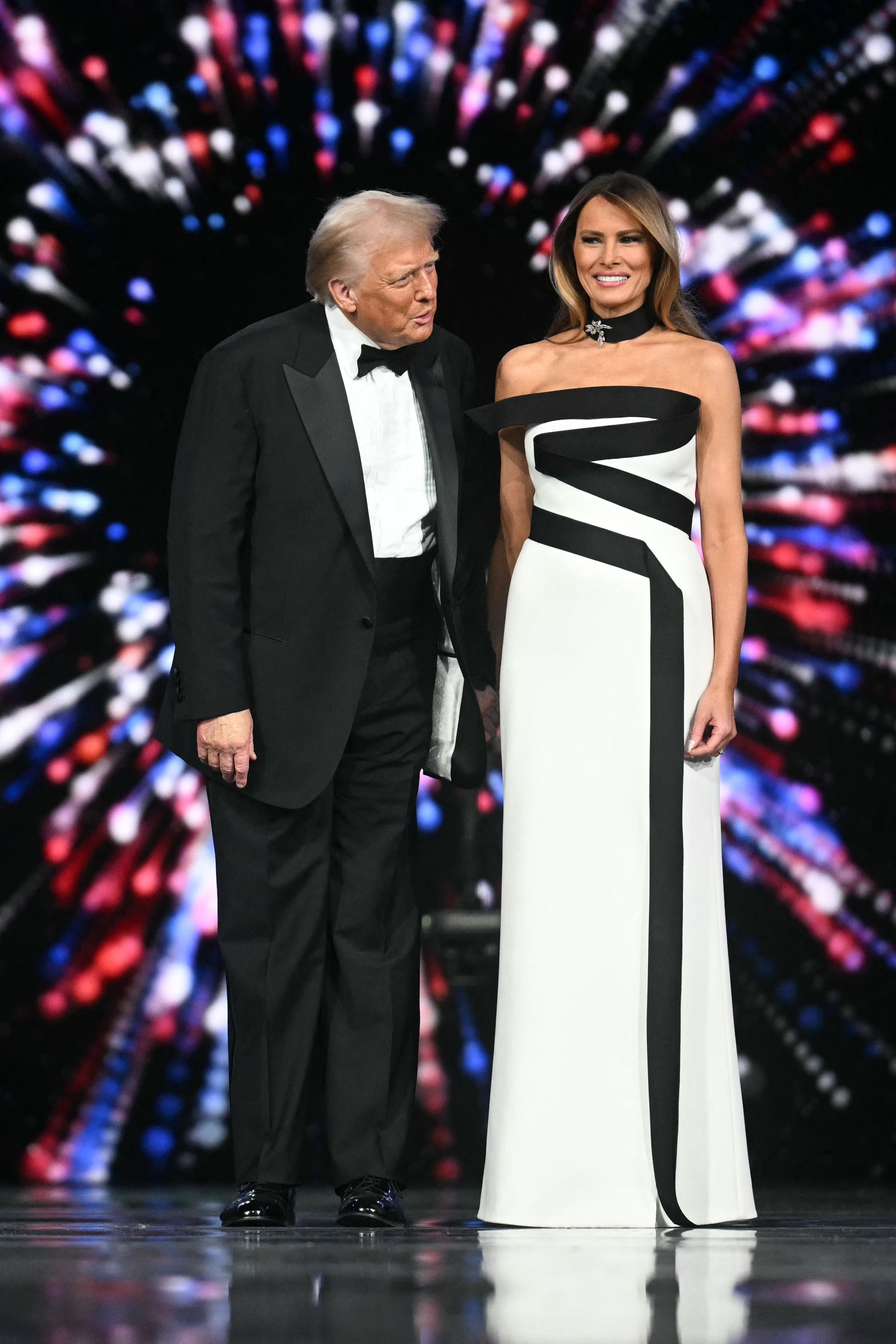 US President Donald Trump (L) and First Lady Melania Trump arrive for the Liberty inaugural ball in Washington, DC, on January 20, 2025. (Photo by Jim WATSON / AFP)