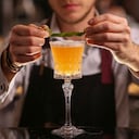 Bartender is making Pisco sour alcohol cocktail drink