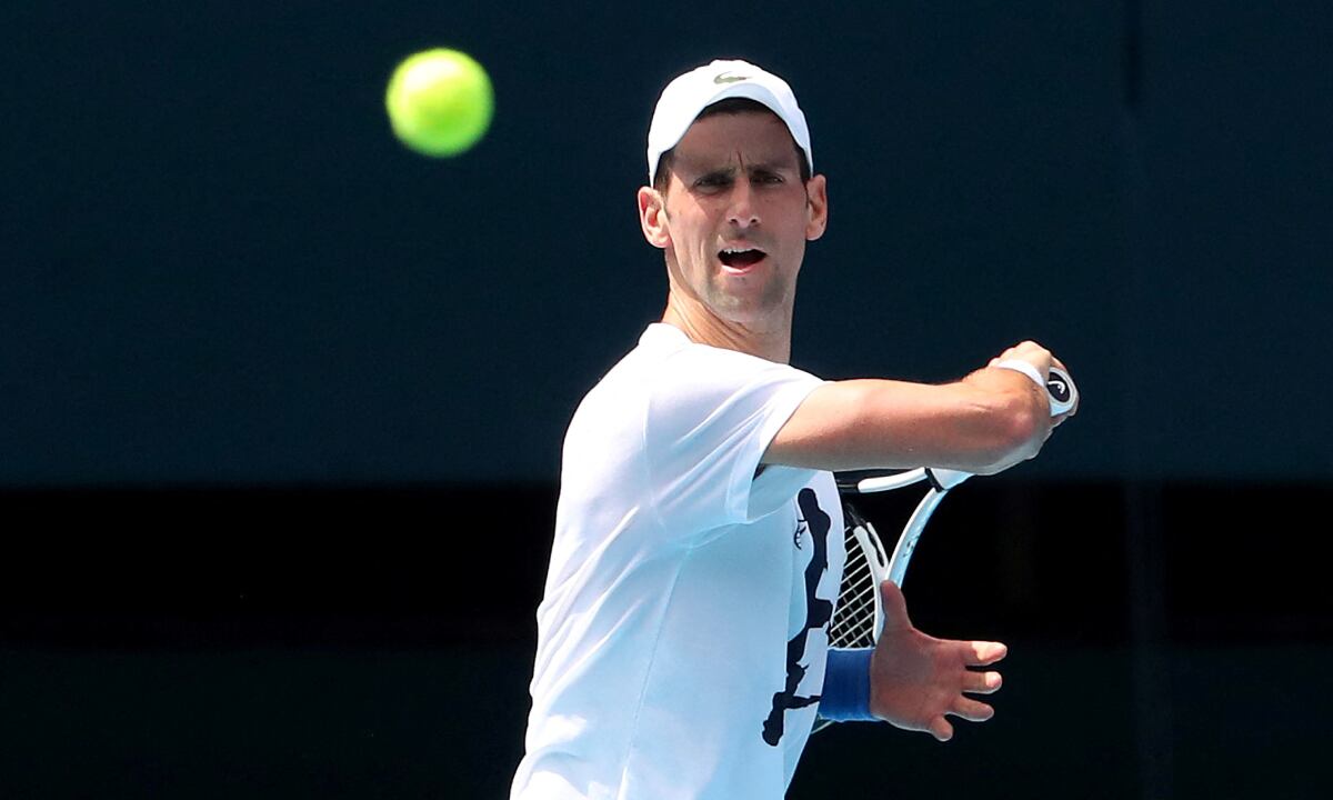 FILE PHOTO: Serbian tennis player Novak Djokovic practices on Rod Laver Arena ahead of the 2022 Australian Open at Melbourne Park, in Melbourne, Australia, January 11, 2022. REUTERS/Kelly Defina/Pool