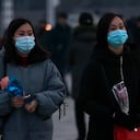 Citizens visit the bronze statues of their late leaders Kim Il Sung and Kim Jong Il on Mansu Hill in Pyongyang, North Korea Thursday, Dec. 16, 2021, on the occasion of 10th anniversary of demise of Kim Jong Il. (AP Photo/Jon Chol Jin)